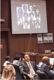  ?? Associated Press ?? Defendant Lonnie Franklin Jr., seated at far left, showed no emotion as a prosecutor showed a montage of photos of the victims.