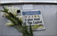  ??  ?? A memorial for Capital Gazette sports writer John McNamara is displayed at a seat in the press box before a baseball game between the Baltimore Orioles and the Los Angeles Angels, Friday, June 29, 2018, in Baltimore. McNamara is one of five victims in a shooting in the newspaper’s newsroom Thursday in Annapolis, Md. (AP Photo/Gail Burton)