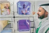  ?? AFP ?? Saudi men are pictured inside sleep pods in Mecca. —