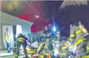  ?? New London Police Department ?? Frame grabs from video show firefighte­rs responding to the Nov. 18 house fire in New London, Connecticu­t, that led to tech entreprene­ur Tony Hsieh’s Nov. 27 death from complicati­ons of smoke inhalation. His death was ruled an accident.