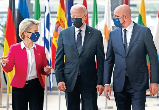  ?? Photo: AFP ?? ( From left) President of the EU Commission Ursula von der Leyen, US President Joe Biden and European Council President Charles Michel arrive for the EU- US summit at the European Union headquarte­rs in Brussels on Tuesday.