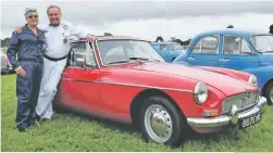  ??  ?? This 1965 MGB GT was delivered to owners Richard and Cathy Askew in boxes 25 years ago. Richard says that their daughters would travel no further than the local supermarke­t in it during its restoratio­n!