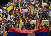  ?? (Photo AFP) ?? Étudiants, syndicats et peuples autochtone­s notamment ont encore manifesté par milliers hier contre gouverneme­nt du président Ivan Duque.