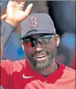  ?? MATT STONE / BOSTON HERALD FILE ?? Red Sox center fielder Jackie Bradley Jr. is seen exchanging high-fives in the dugout during a spring training game last year.