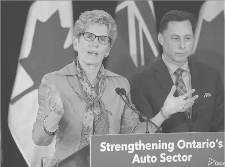  ?? STAN BEHAL ?? Premier Kathleen Wynne, left, and Brad Duguid, economic developmen­t minister, meet with auto industry leaders Friday in Toronto to discuss potential trade problems with the United States. Wynne says U.S. leaders are aware how important trade with...