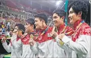  ?? AP PHOTO ?? Japan claimed their first team gold since 2004 in the Rio Olympic Arena ahead of Russia and China.