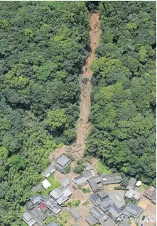  ??  ?? The site of a mudslide caused by heavy rain in Ashikita, Kumamoto prefecture, southweste­rn Japan, on Saturday.