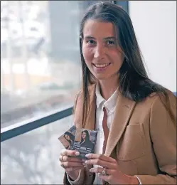  ?? (AP/LM Otero) ?? Anna Bottinelli (above photo), president of the Monuments Men Foundation for the Preservati­on of Art, poses with playing card decks Monday in Dallas. Bottinelli (bottom photo) displays playing cards.