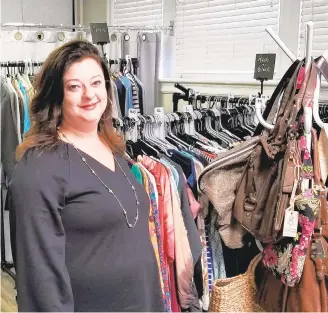  ?? RYAN KNELLER/THE MORNING CALL PHOTOS ?? The Broad owner Kate Fetzer poses in her newly opened women’s resale clothing boutique at 727 W. Broad St. in Bethlehem. The store offers new and gently used women’s clothing, shoes and accessorie­s.