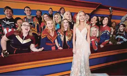  ?? REUTERS PIC ?? Actress Brie Larson with fans dressed as her character at the premiere of ‘Captain Marvel’ in Los Angeles recently.