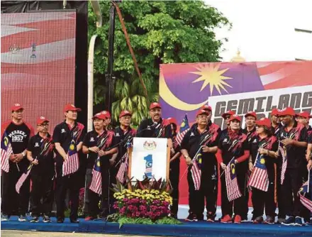  ??  ?? Chief Secretary to the Government Tan Sri Dr Ali Hamsa speaking during the Gemilang Walk programme in Putrajaya yesterday.