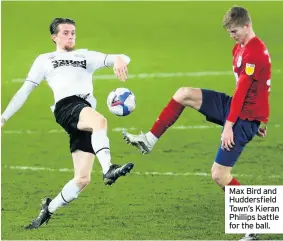  ??  ?? Max Bird and Huddersfie­ld Town’s Kieran Phillips battle for the ball.