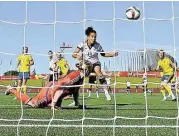  ?? Dennis Grombkowsk­i/Bongarts / Getty Images ?? Germany’s Celia Sasic beats Swedish keeper Hedvig Lindahl for one of her two goals in the 4-1 win.