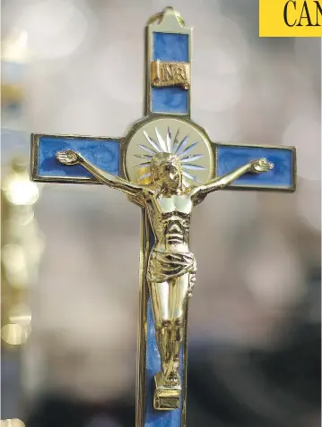 ?? PETER MACDIARMID / GETTY IMAGES ?? A crucifix on display in Vatican City. The decision of Saint-Sacrament Hospital in Quebec City to remove — then restore — its own crucifix has stirred up debate in Quebec over the public display of religious imagery.