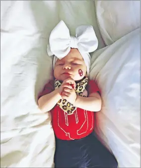  ??  ?? OU fan Bailey Shomo decided to name her daughter Baker Lou after Baker Mayfield led the Cleveland Browns to victory in his NFL debut last September. [PHOTO PROVIDED]
