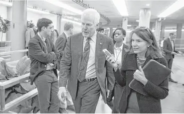  ?? Al Drago / New York Times ?? Sen. John Cornyn, R-Texas, arrives for a vote on budget resolution­s on Capitol Hill in Washington on Thursday. Cornyn placed a hold on an official’s confirmati­on pending assurances Texas will receive more disaster funds.