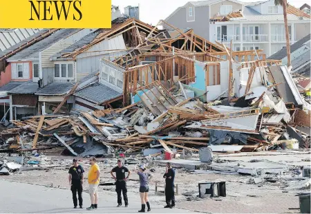  ?? GERALD HERBERT / THE ASSOCIATED PRESS ?? Rescue personnel perform a search operation in the aftermath of hurricane Michael in Mexico Beach, Fla., on Thursday.