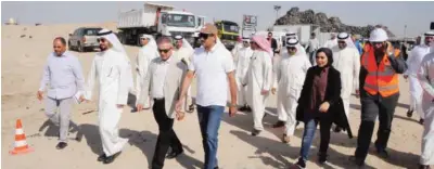  ??  ?? KUWAIT: Minister of Commerce and Industry Yousif Al-Ali and other officials inspect the site of used tires and waste disposal in Rehayya yesterday. —Photos by Fouad Al-Shaikh