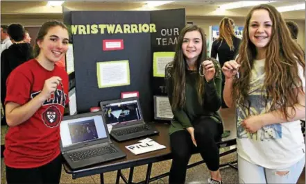  ?? CANDICE MONHOLLAN — DIGITAL FIRST MEDIA ?? Three Fugett Middle School eighth graders came up with a hidden date-rape drug detector as part of their business concept to try and advance to the Shark Tank held later in the school year.