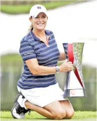  ??  ?? Cristie Kerr with her trophy after winning her 20th career title at the Sime Darby LPGA Malaysia tournament at the TPC Kuala Lumpur yesterday.