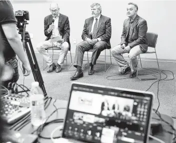  ?? Elizabeth Conley / Staff photograph­er ?? A coronaviru­s town hall Saturday with John P. McGovern Museum CEO John Arcidiacon­o, left, UTMB’s
Dr. Scott C. Weaver and Dr. Umair Shah, with Harris County public health, was livestream­ed out of caution.