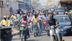  ??  ?? COTONOU: This file photo shows motorcycli­sts driving on a major road in Cotonou.
