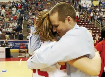  ?? KIRK NEIDERMYER — FOR DIGITAL FIRST MEDIA ?? Upper Dublin’s head coach Morgan Funsten gives senior Maggie Weglos a hug after winning the PIAA 6A championsh­ip at the Giant Center in Hershey Tuesday.