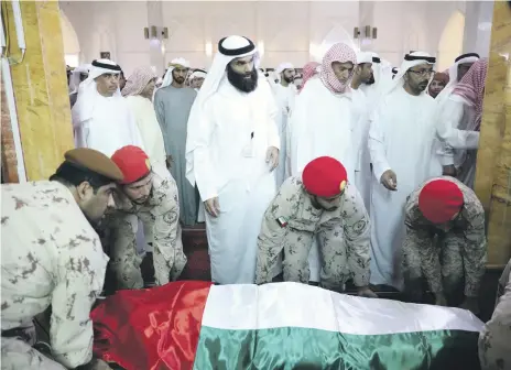  ?? Wam ?? Emergency service and military personnel attended the funeral of Jasim Abdullah Al Tanaiji in Ras Al Khaimah on Monday