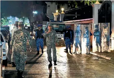  ?? PHOTO: AP ?? Soldiers and riot police patrol the main street of the Maldives capital, Male, after the government declared a 15-day state of emergency.