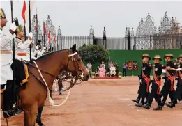  ?? — PTI ?? President Ram Nath Kovind and his wife Savita witness the ceremonial change of guard ceremony at Rashtrapat­i Bhavan in New Delhi on Sunday.