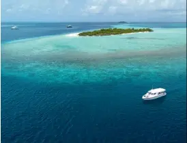  ??  ?? Hanifaru Bay is accessible only via taxi vessels. Below: Baa Atoll is home to some of the richest coral reef systems in the world.