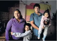  ?? NATACHA PISARENKO THE ASSOCIATED PRESS ?? Rosemary Paez Carabajal, her husband Yonoma Saenz and their children, Laisa and Leonardo. Carabajal sells coffee on the streets in Buenos Aires, but can no longer do her job after the COVID-19 lockdown.