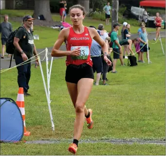  ?? PHOTO BY MARK STOCKWELL — BOSTON HERALD ?? Holliston High’s Carmen Luisi placed first in the junior/senior girls division at the MSTCA Cross-Country Relay race at Highland Park in Attleboro on Sept. 9.