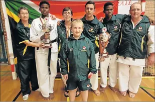  ??  ?? MISSION ACCOMPLISH­ED: Karateka proudly display medals won at the sixth WJKA World Championsh­ip held in Vlissingen, Netherland­s. Pictured are Charleen Meiring, Chuma Ngoqo, Elsie Potgieter, Travis Bartosch, Yanga Ngoqo, Seane Richter and Leon Muller