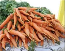  ?? MEDIANEWS GROUP FILE PHOTO ?? A bushel of carrots is on display. Fresh fruits and vegetables contain many nutrients and can help lower the risk of high cholestero­l.