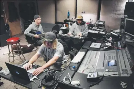  ??  ?? Alex Medellin (keyboard), Cory Wythe (guitar) and Tyler Unland (drums) of Late Night Radio and Marvel Years jam at a studio in Denver. EDM bands such as Late Night Radio, Sunsquabi and Marvel Years are part of Colorado’s uniquely thriving electrosou­l...