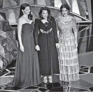  ??  ?? From left, Ashley Judd, Annabella Sciorra and Salma Hayek, three accusers of Harvey Weinstein, speak Sunday at the Oscars at the Dolby Theatre in Los Angeles.