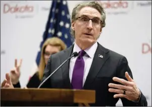  ?? The Associated Press ?? SPIKING STATES: North Dakota Gov. Doug Burgum speaks April 10 at the state Capitol in Bismarck, N.D. Hospitaliz­ations from COVID-19 have hit their highest points recently throughout the Midwest, where the growth in new cases has been the worst in the nation. Burgum acknowledg­es his state’s numbers are moving in the wrong direction as it hit new highs for active and newly confirmed cases, as well as hospitaliz­ations. But he’s also touting the state’s test positivity staying in the 7% range.