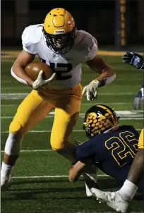  ??  ?? Oxford sophomore Tate Myre, left, ran for his team’s lone touchdown in a 21-7 Division 1 playoff loss to host Clarkston on Friday. This game was closer than when the two teams met earlier this season. Clarkston prevailed in that contest, 35-14.