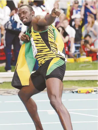  ??  ?? Usain Bolt détient les records mondiaux du 100 mètres (9s58c) et du 200 mètres (19s19c), tous deux réalisés en 2009. - Archives