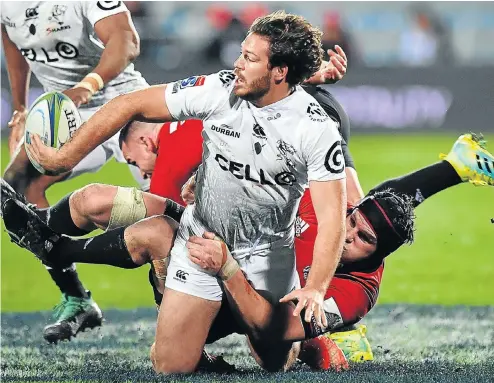  ?? Picture: AFP PHOTO ?? Marius Louw of the Sharks is tackled by Crusaders’ Ryan Crotty, left, and Matt Todd during the Super Rugby quarterfin­al yesterday. The Crusaders won 40-10.