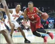  ??  ?? North Carolina State guard Dennis Smith Jr. (4) is part of a deep point guard class in the 2017 NBA Draft. He averaged 18.1 points, 6.2 assists and 4.6 rebounds in one season for the Wolf Pack.