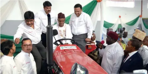  ??  ?? Kaduna State Governor, Nasir El-rufai, test driving one of the tractors, during the commission­ing of the Mahindra Tractors Assembly Plant, Kaduna, with top officials of the company.