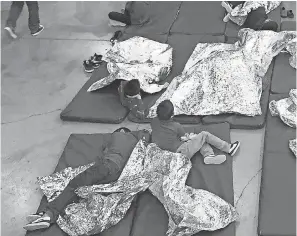  ?? U.S. CUSTOMS AND BORDER PROTECTION VIA AP ?? While adults face criminal charges, children rest at a facility in McAllen, Texas.