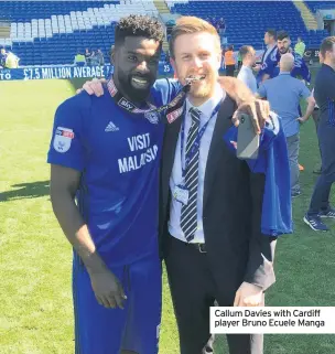  ??  ?? Callum Davies with Cardiff player Bruno Ecuele Manga