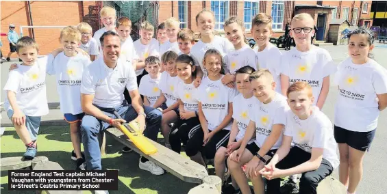  ??  ?? Former England Test captain Michael Vaughan with youngsters from Chesterle-Street’s Cestria Primary School