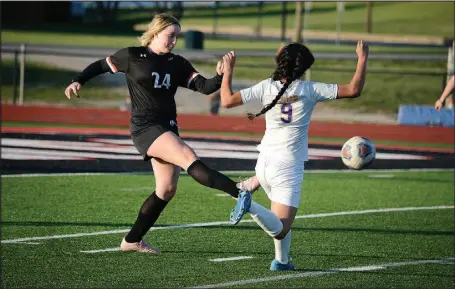  ?? BENNETT HORNE/MCDONALD
COUNTY PRESS ?? McDonald County sophomore Natalie Gillming kicks the ball past Monett’s Deleny Rueda during the Lady Mustangs’ 1-0 victory on Thursday, April 14.