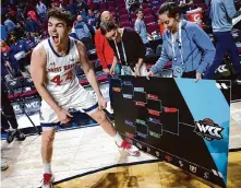  ?? Ellen Schmidt/Associated Press ?? St. Mary's guard Alex Ducas enjoys moving the Gaels to the final line of the WCC tournament bracket.