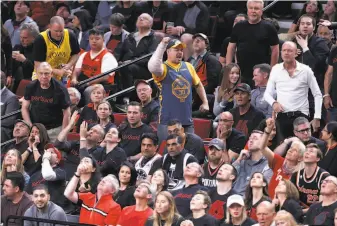  ?? Photos by Scott Strazzante / The Chronicle ?? A Warriors fan reacts during his team’s 110-99 win over the Trail Blazers in Game 3 of the Western Conference finals in Portland. Another win would provide even more to celebrate.