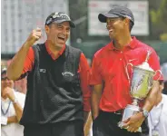  ?? ASSOCIATED PRESS FILE PHOTO ?? Rocco Mediate, left, jokes with Tiger Woods following Woods’ U.S. Open championsh­ip victory in 2008 after playing a sudden death hole following an 18-hole playoff round for the US Open championsh­ip at Torrey Pines Golf Course in San Diego. The U.S....